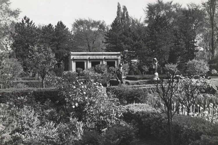 <span class="content-image-text">Mr. William G. Mather standing amid his famed gardens at the Gwinn designed by Warren H. Manning in 1941.</span>