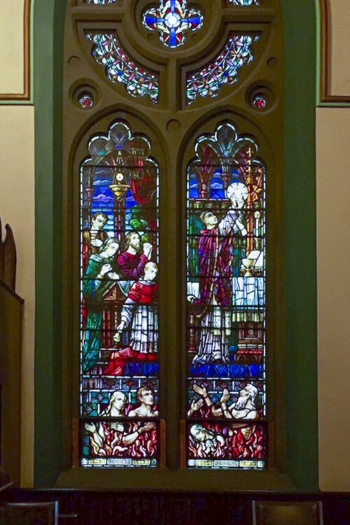 <span class="content-image-text">Purgatory Window: One of St. Paul Shrine's Francis Xavier Zettler windows, this unusual stained glass window depicts the mass being said as souls in purgatory await their release to Heaven.</span>