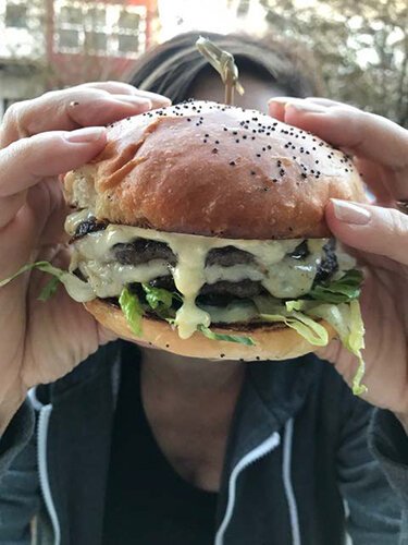 Hiding behind a Good Boi burger from the now-defunct Good Company