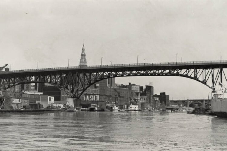 The view on the Cuyahoga River looking southeast toward the Main Avenue Bridge and the east bank of the Flats in 1954.