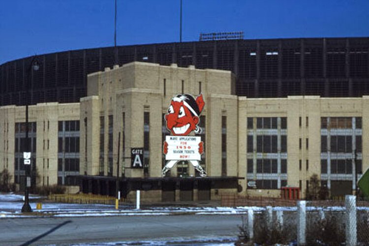 The Cleveland Indians play the Philadelphia Athletics at the first-ever baseball game at Cleveland Municipal Stadium in 1932