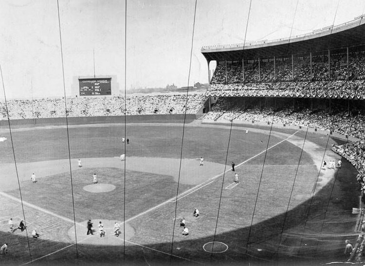 The Cleveland Indians play the first-ever baseball game at Cleveland Municipal Stadium against the Philadelphia Athletics in 1932