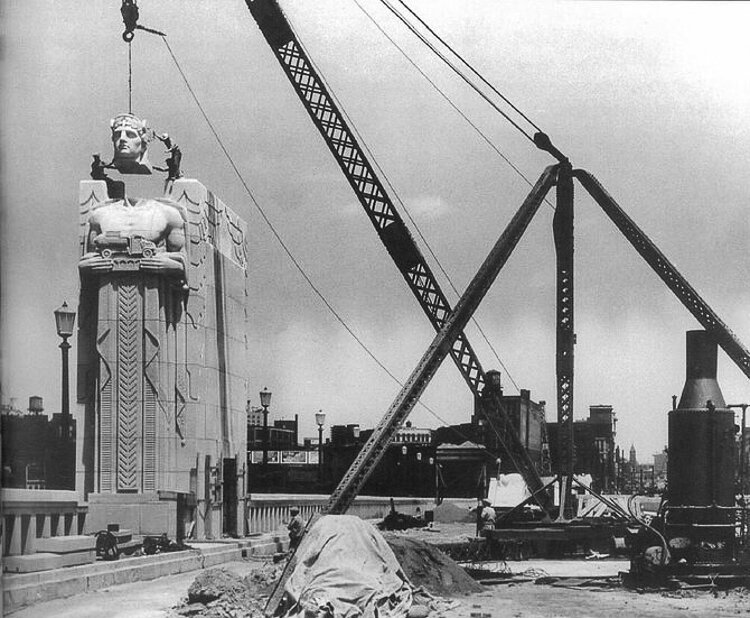 Stonemasons assemble the pylons of the Lorain_Carnegie Bridge in 1932.