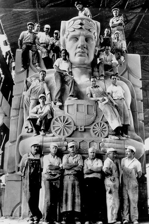 <span class="content-image-text">Stone carvers pose on a pylon of the Lorain-Carnegie Bridge, later renamed the Hope Memorial Bridge, ca. 1931.</span>