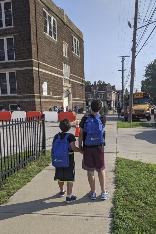 <span class="content-image-text">12 year old Sam Hooper and 7 year old Oliver Hooper at Tremont Montessori School.</span>