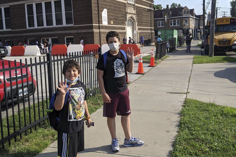 12-year-old Sam Hooper and 7-year-old Oliver Hooper at Tremont Montessori School.