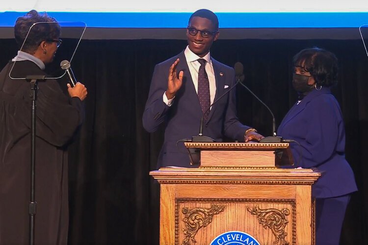 Ohio Supreme Court Justice Melody Stewart administered the oath of office to Justin Bibb while his mother, Charlene Nichols, held the Bible