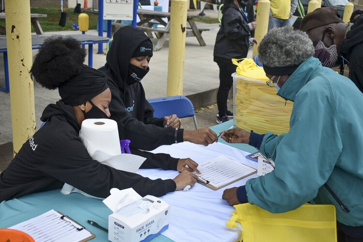 <span class="content-image-text">EmpowerCLE’s Brand Ambassadors recruiting residents at a community event in Cleveland’s Hough neighborhood.</span>