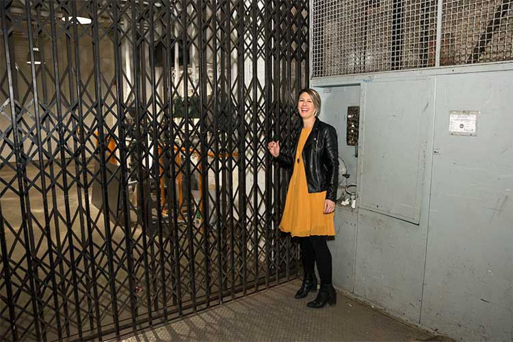 Stephanie taking the freight elevator down to the Flea Shop