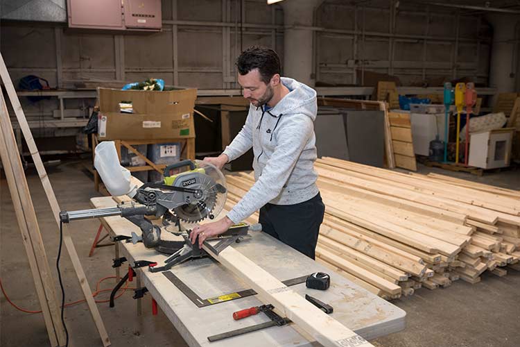 Creative Experience Manager Sam Pearson working in the Flea Shop