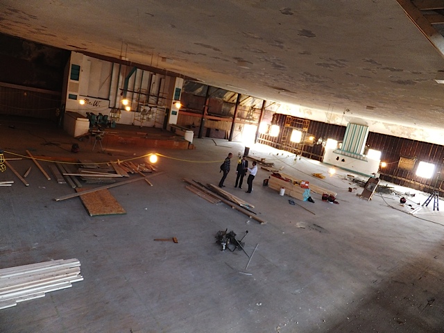 Councilman Brian Cummins, CDC rep. Adam Stalder and Ali Faraj on the main floor of the Aragon
