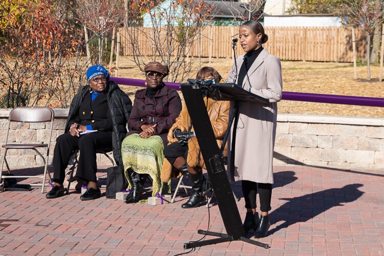 Poet Ali Black recites a her poem “Garden of Eleven Angels” at the grand opening.