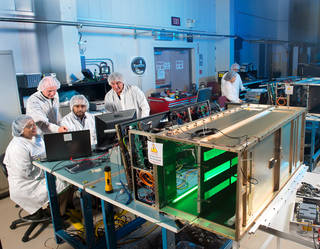 A team of scientists and engineers test the components of Saffire