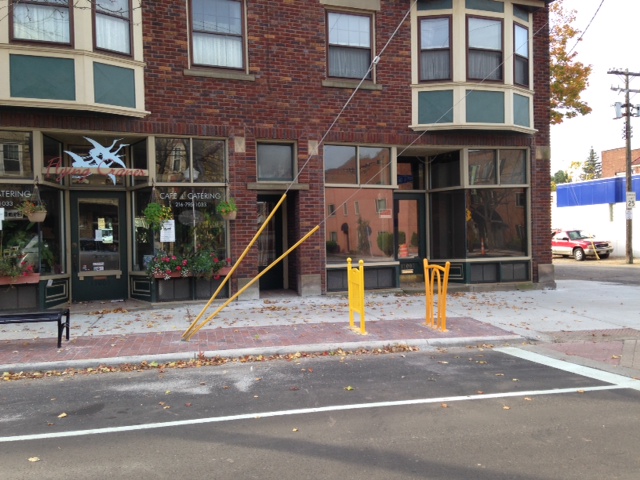 Larchmere streetscape with public art outside Flying Cranes